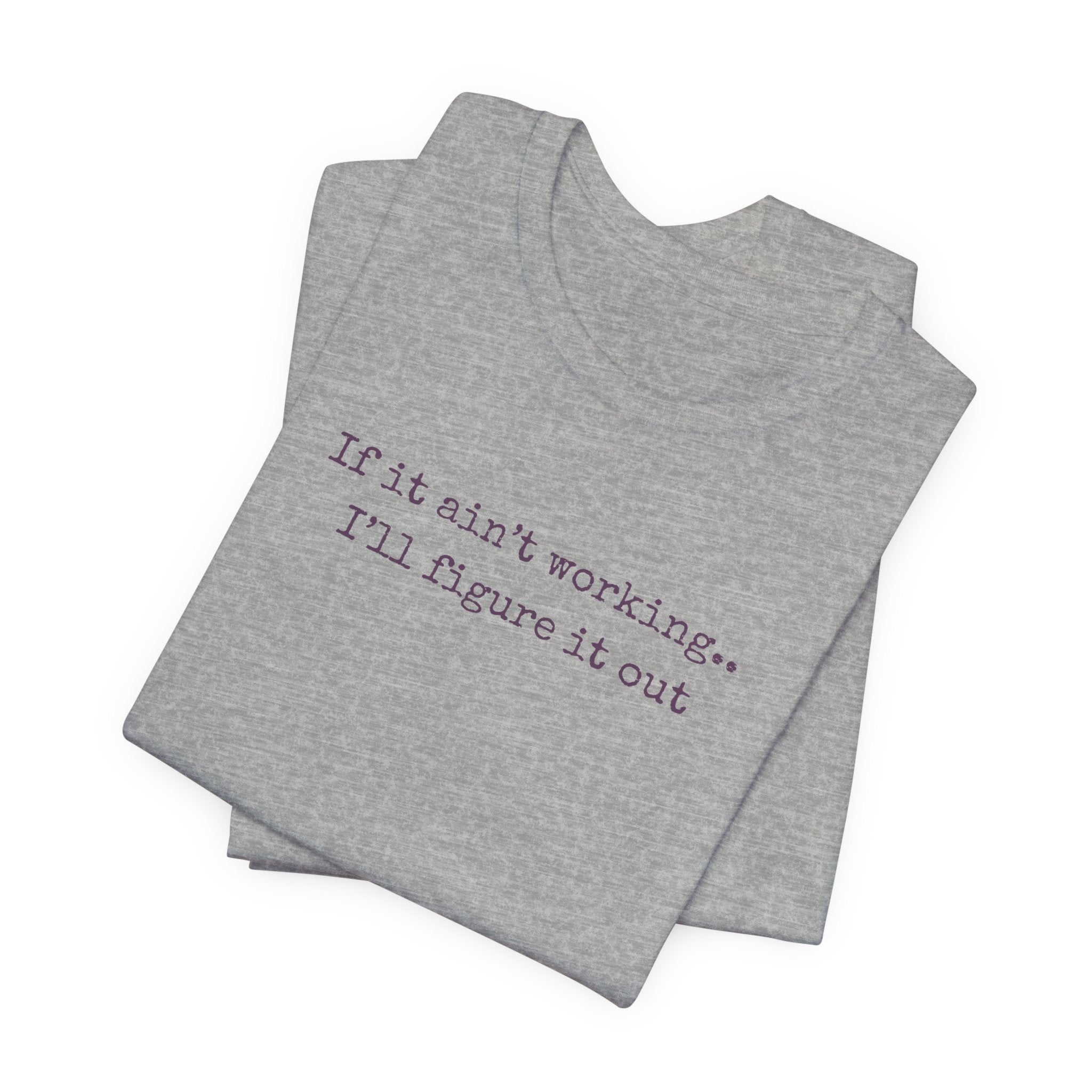 "If it ain't working... I'll figure it out" Minimalist Motivational T‑Shirt